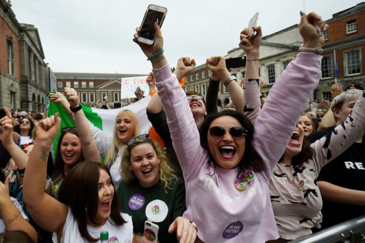 People celebrate the result of yesterday's referendum on liberalizing abortion law, in Dublin